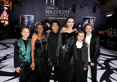 Angelina Jolie and her brood posing for a photo in the premiere of her new movie with all smiles.