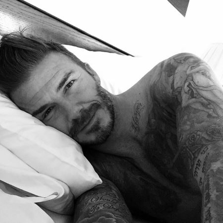 Topless and Headshot photo of David Beckham lying in bed with his head on the pillow. First post on Instagram.