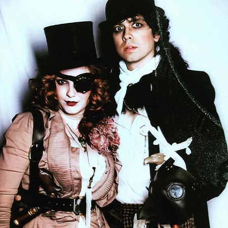 Christina with a eyepatch with Geoffrey, costumed for Halloween in steam punk theme.