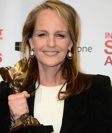Helen holding an Emmy award.