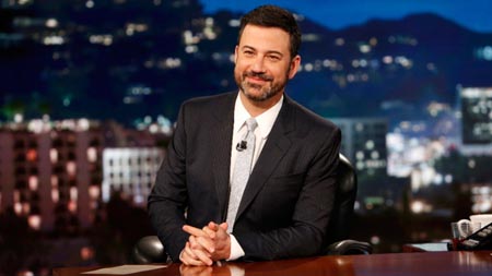 Jimmy Kimmel behind his desk on his show.