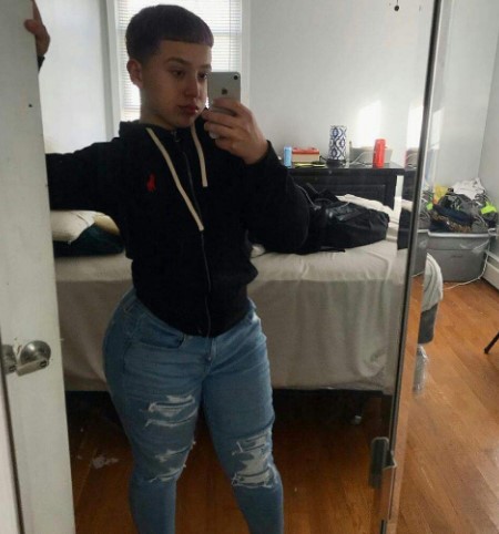 Timmy Thick taking a mirror selfie.