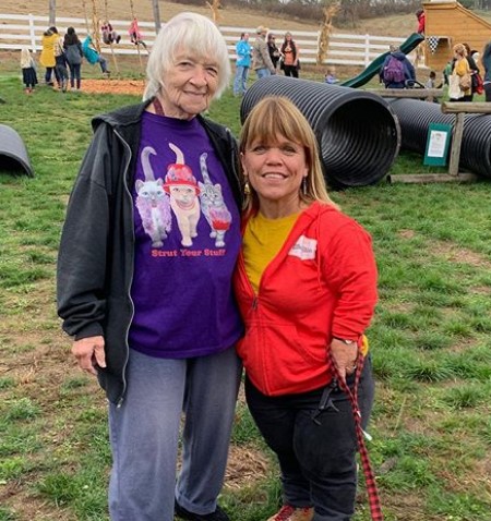 Amy standing for a pose with an elderly fan.