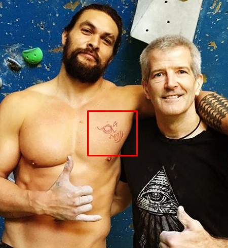 Jason with his tattoo artist.