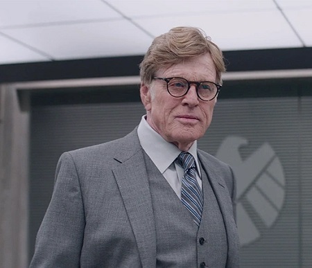 Redford as 'Alexander Pierce' on 'Avengers: Endgame'. Wearing glasses and a grey suit.