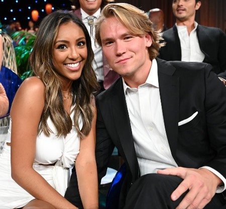 Tayshia and Jones attending a wedding.