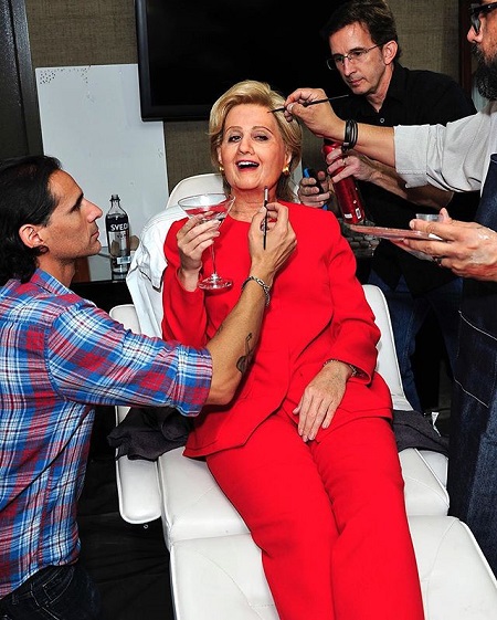 Katy Perry put on Hillary Clinton makeup by her guys.