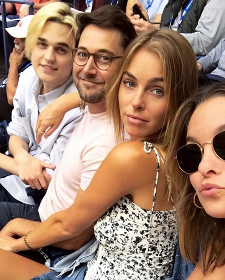 Ryan and Liz at the center as her sister takes the selfie with his brother beside him.