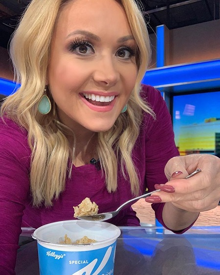 Jaime Cerreta scooping a spoon of cornflakes and taking a selfie while smiling.