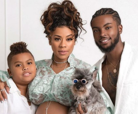 Niko and Keshia with their son, and dog.