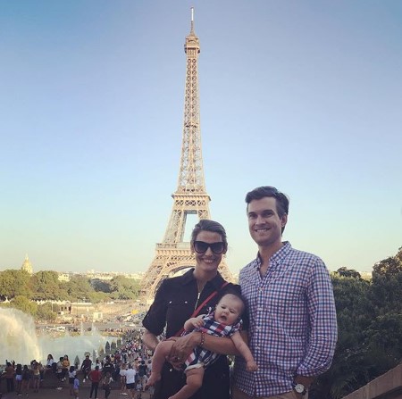 Shelby, Jon, and Zoe posing in from of Eiffel Tower.