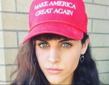 Theryn wearing a MAGA cap.