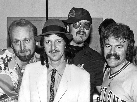 A black&white photo of the Doobie Brothers back in the day. The four current members.