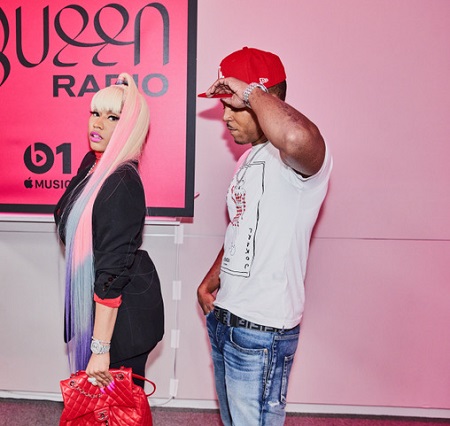 Nicki Minaj and Kenneth Petty heading into the Queen Radio studio. His net worth is not even a million dollars.