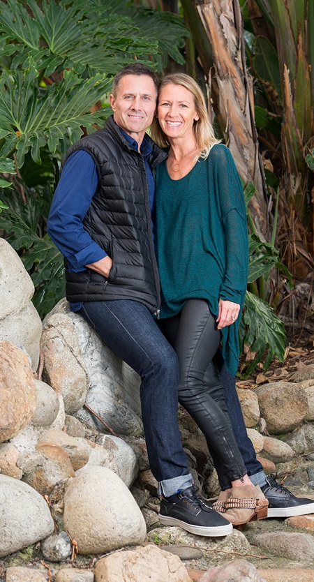 Erin and Rob Estes stroll on the shore near their San Clemente home.