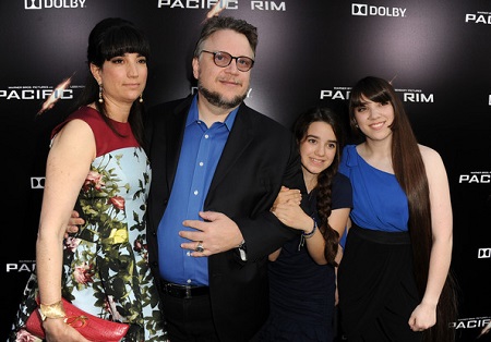 Filmmaker Guillermo del Toro (R) and Lorenza Newton with children arrive at the premiere of Warner Bros. Pictures' and Legendary Pictures' "Pacific Rim" at Dolby Theatre on July 9, 2013 in Hollywood, California.