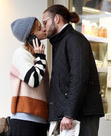 Emma Watson kissing a mysterious man.