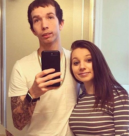 Bryan and Lissy taking a mirror selfie.