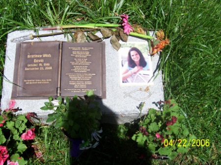 Snap of the cemetery memorial for Brittinay with her photo beside the stone inscription.