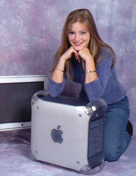 Justine Ezarik resting her hands on an iPhone computer box.