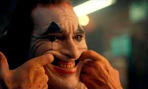 joaquin in clown makeup, smiling 