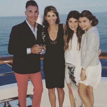 (from left) Mossimo Giannulli, Lori Loughlin, Isabella Rose and Olivia Jade on a sailboat.