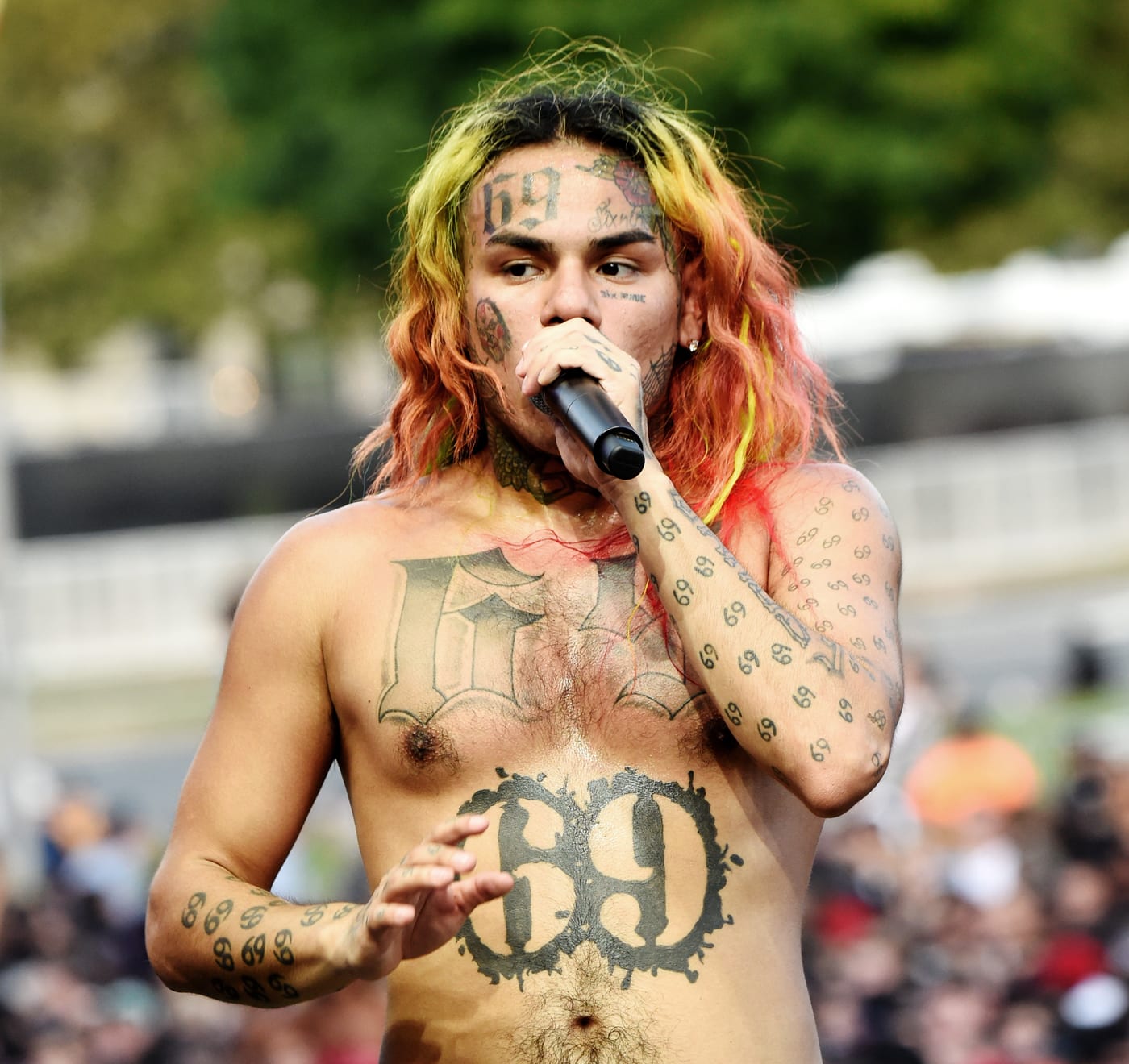 tekashi on stage with 69 all over his body 