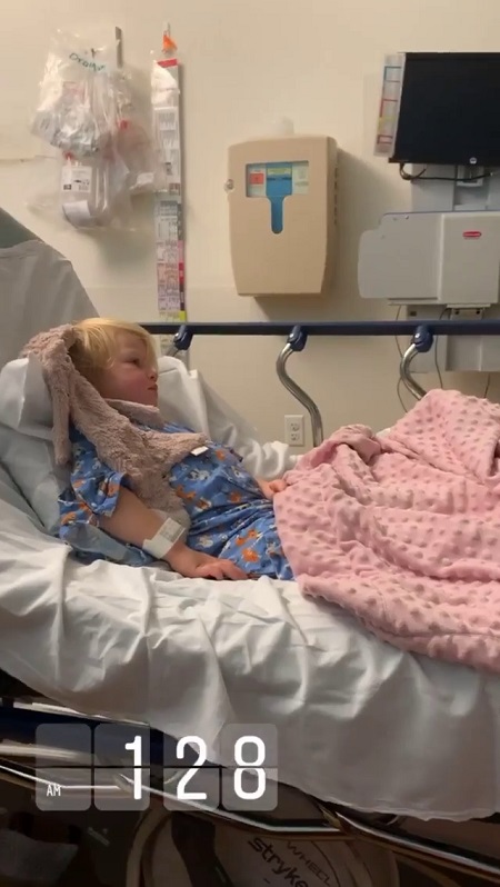 Ember resting on a hospital bed.