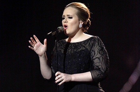 Adele performing on stage during the Brit Awards 2011 at The O2 Arena in London.