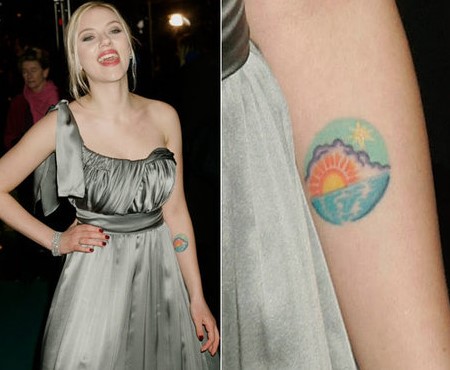Scarlett Johansson tattooed an emblem of beautiful scenery on her right inner arms.