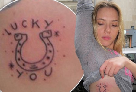 A horseshoe with texts "Lucky you" on Scarlett Johansson's left ribs.