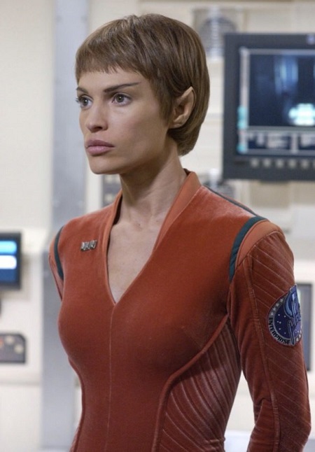 Jolene Blalock in a scene on 'Star Trek: Enterprise' wearing a red suit.