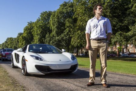 Henry Cavill poses in front of his McLaren MP4 12C Spider.