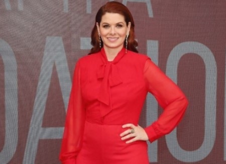 Debra wearing a red dress during an event.
