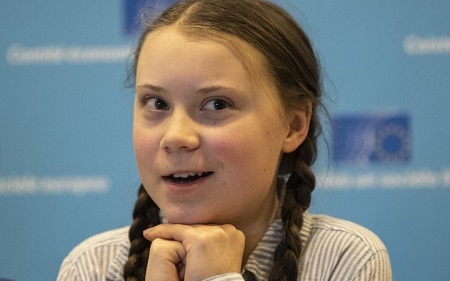 Greta Thunberg smiling.