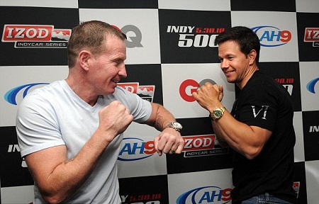 Micky Ward (L) and Wahlberg in boxing positions during a photoshoot.