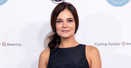 Betsy Brandt walks the red carpet and stops to pose for a photograph.