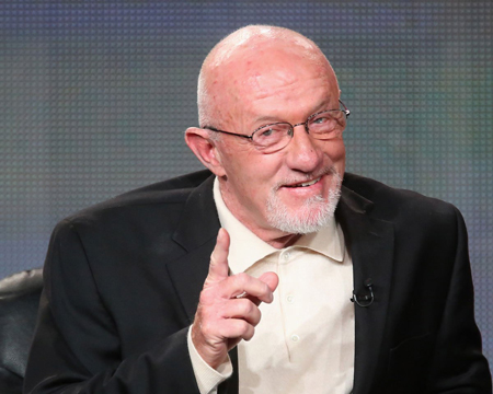 Jonathan Banks laughs at a comment made from the audience and wags his finger a little.