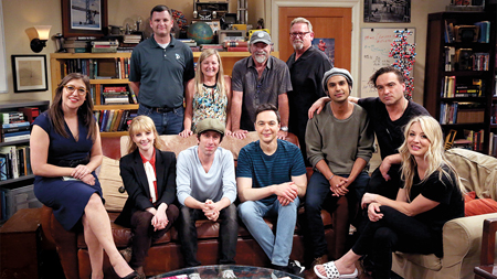 The cast and creators of the show sit together to take a final on set photo.