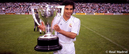 Hugo Sanchez holding a trophy.