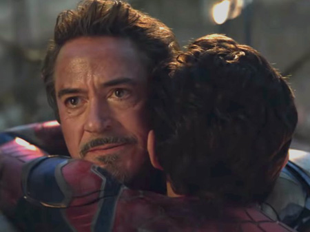 Tony and Peter hug each other.
