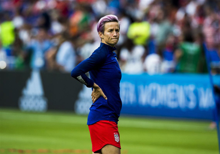 Megan Rapinoe stretches before the match.