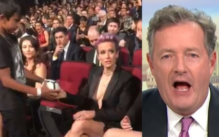 Megan Rapinoe signs a ball and Piers Morgan calls her out.