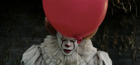 Pennywise holding a balloon.