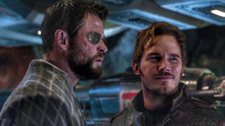 A beaten down Thor and Star Lord stand together inside the Guardians ship.