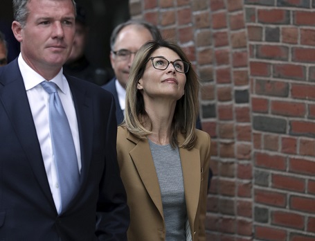 Lori Loughlin departs federal court in Boston on Wednesday, April 3, 2019. She was confident she and her husband wouldn't face any charges