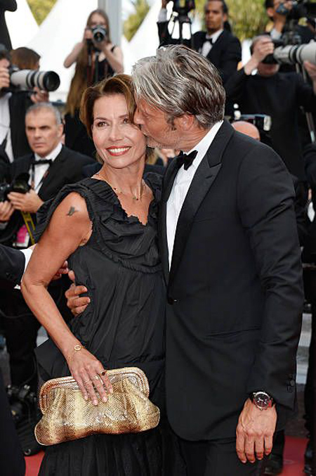 Hanne Jacobsen and Mads Mikelsen at a red carpet.