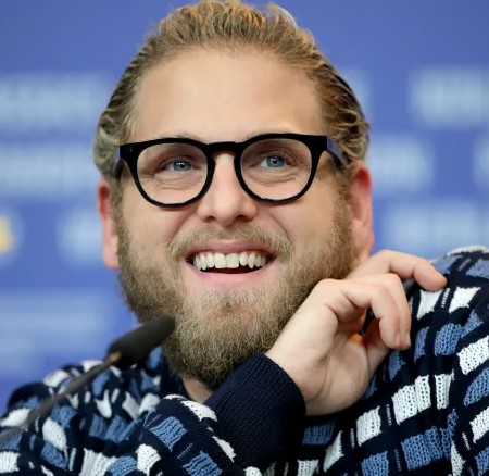 Jonah Hill smiles for the camera during an interview.