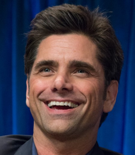 John Stamos grinning