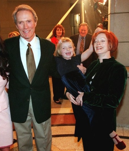 Clint Eastwood poses with his wife Dina, left, actress Frances Fisher, right, and Eastwood’s daughter Francesca at the premiere of his new film “True Crime” Monday, March 15, 1999, on the Warner Bros. lot in Burbank, Calif. Fisher is also a cast member in the film, which Eastwood both directs and stars in.